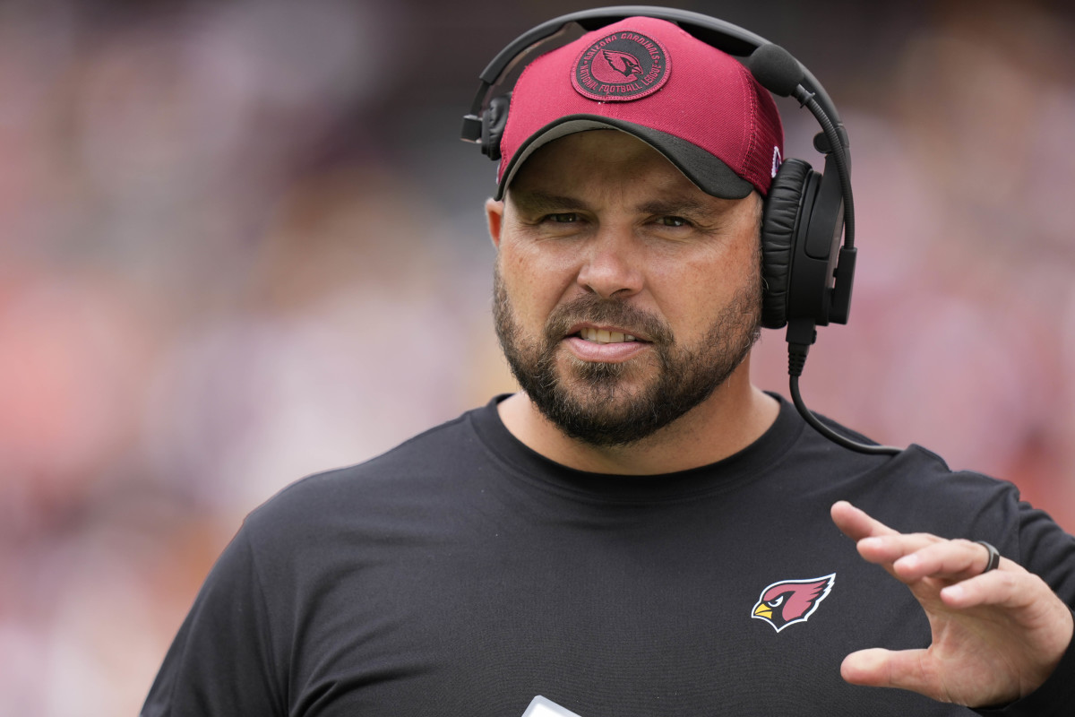 Cardinals offensive line coach Klayton Adams walks on the sideline before the game against the Commanders.